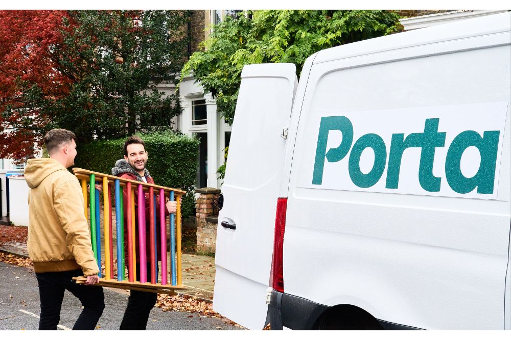 A Porta driver delivering a large item to a customer's door
